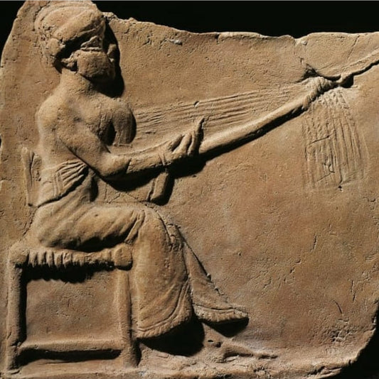 weavers in Mesopotamia using knotting techniques to create intricate textiles