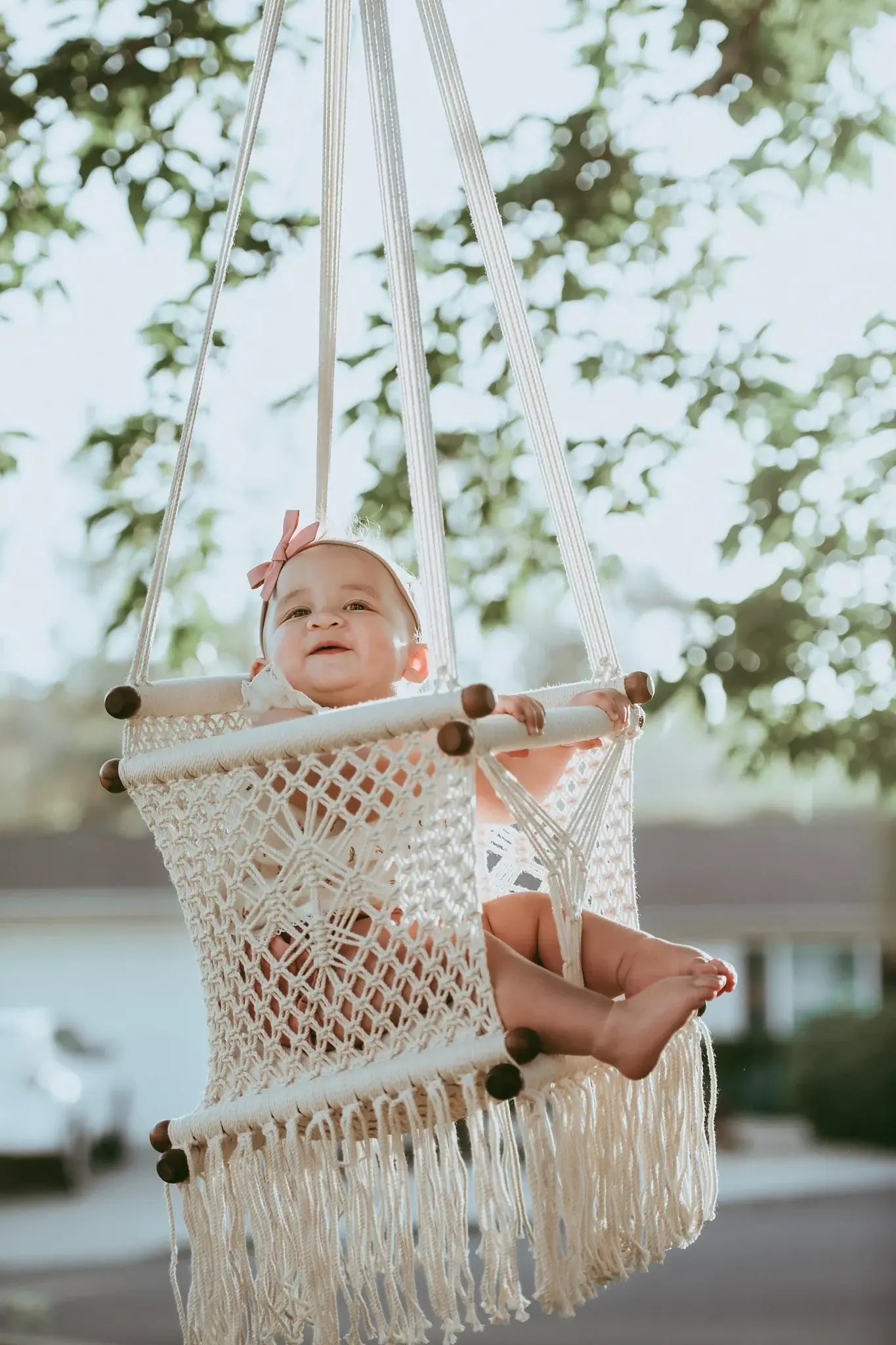baby on a macrame swing chair