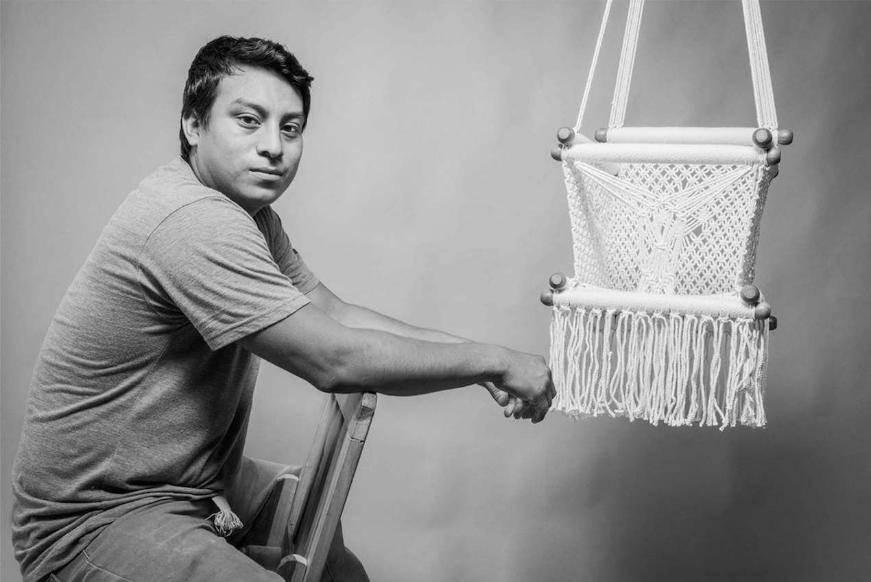 Load video: artisan weaving macrame hanging bassinet