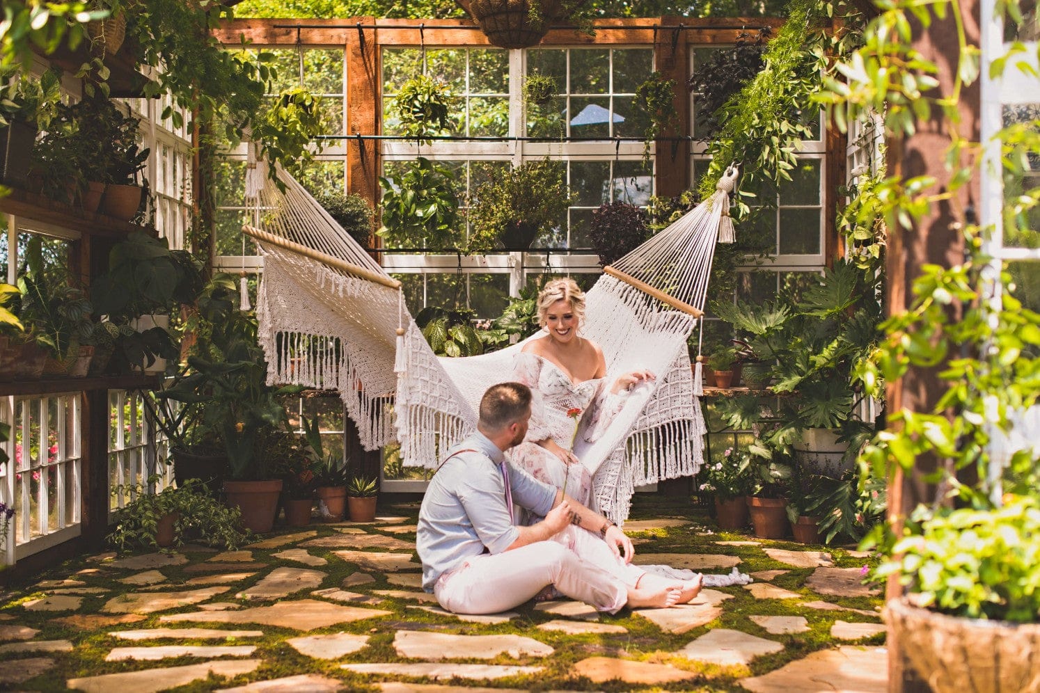 bride and groom on a large size hammock