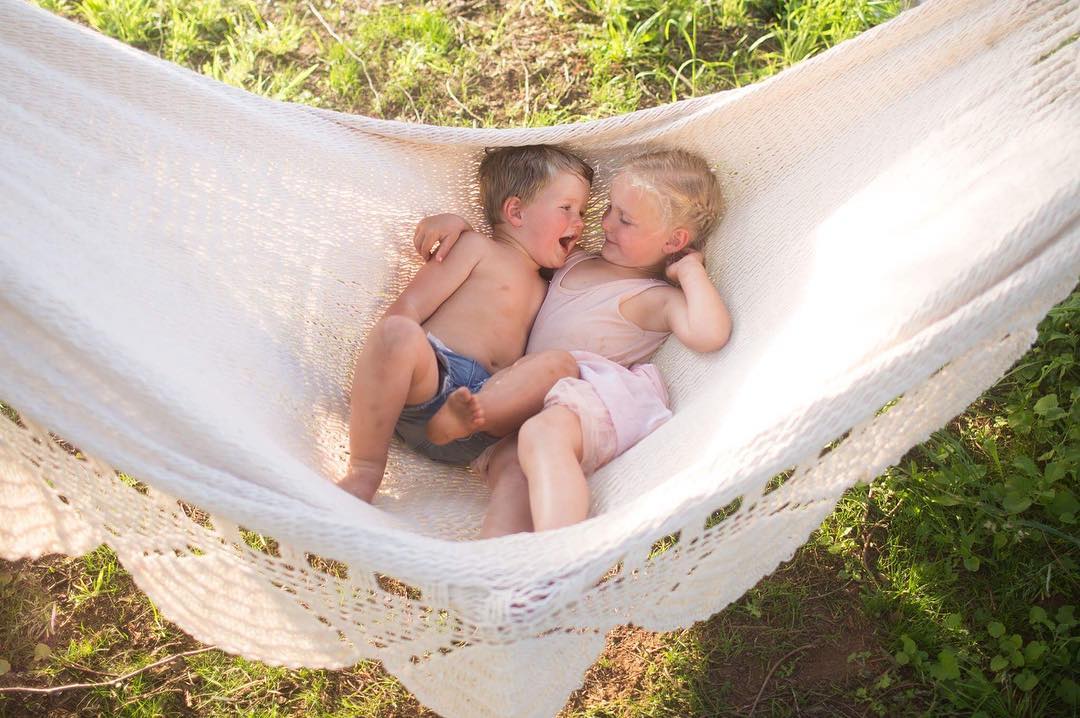 kids on a hammock in the patio