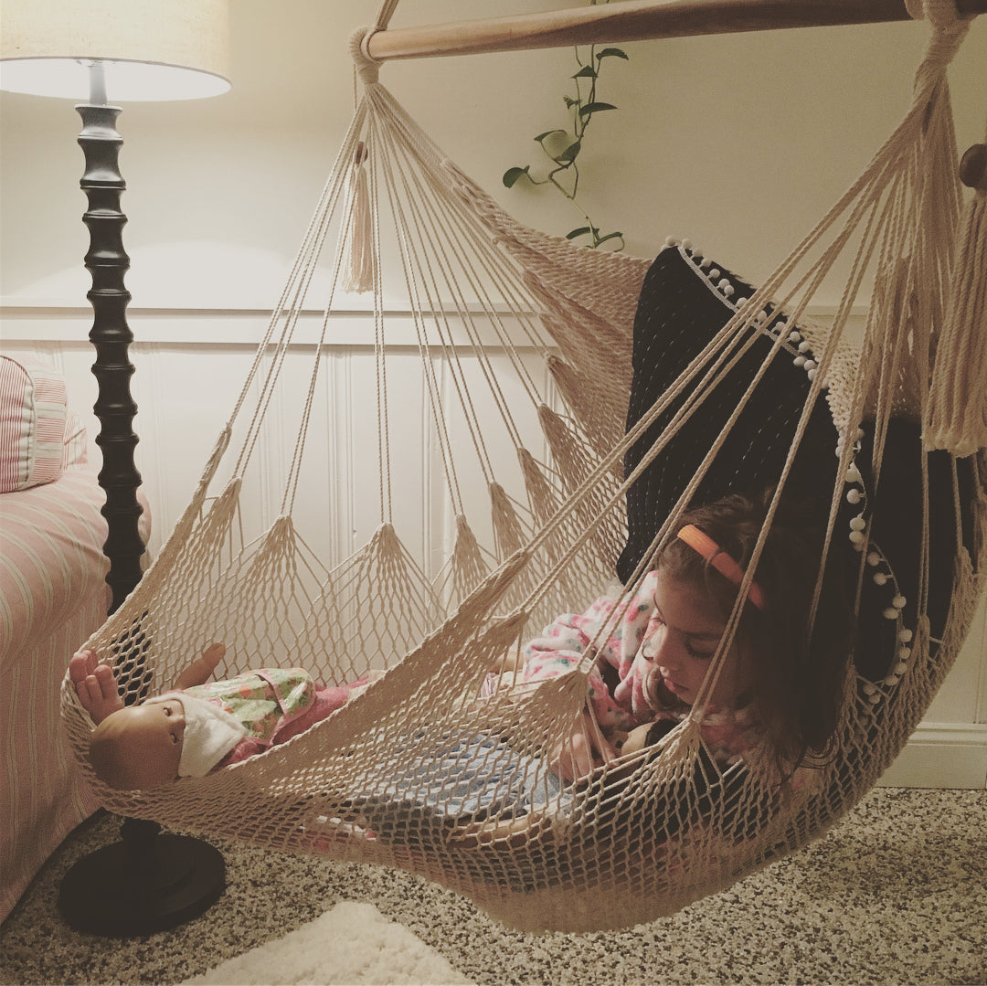 kid sleeping on hammock chair