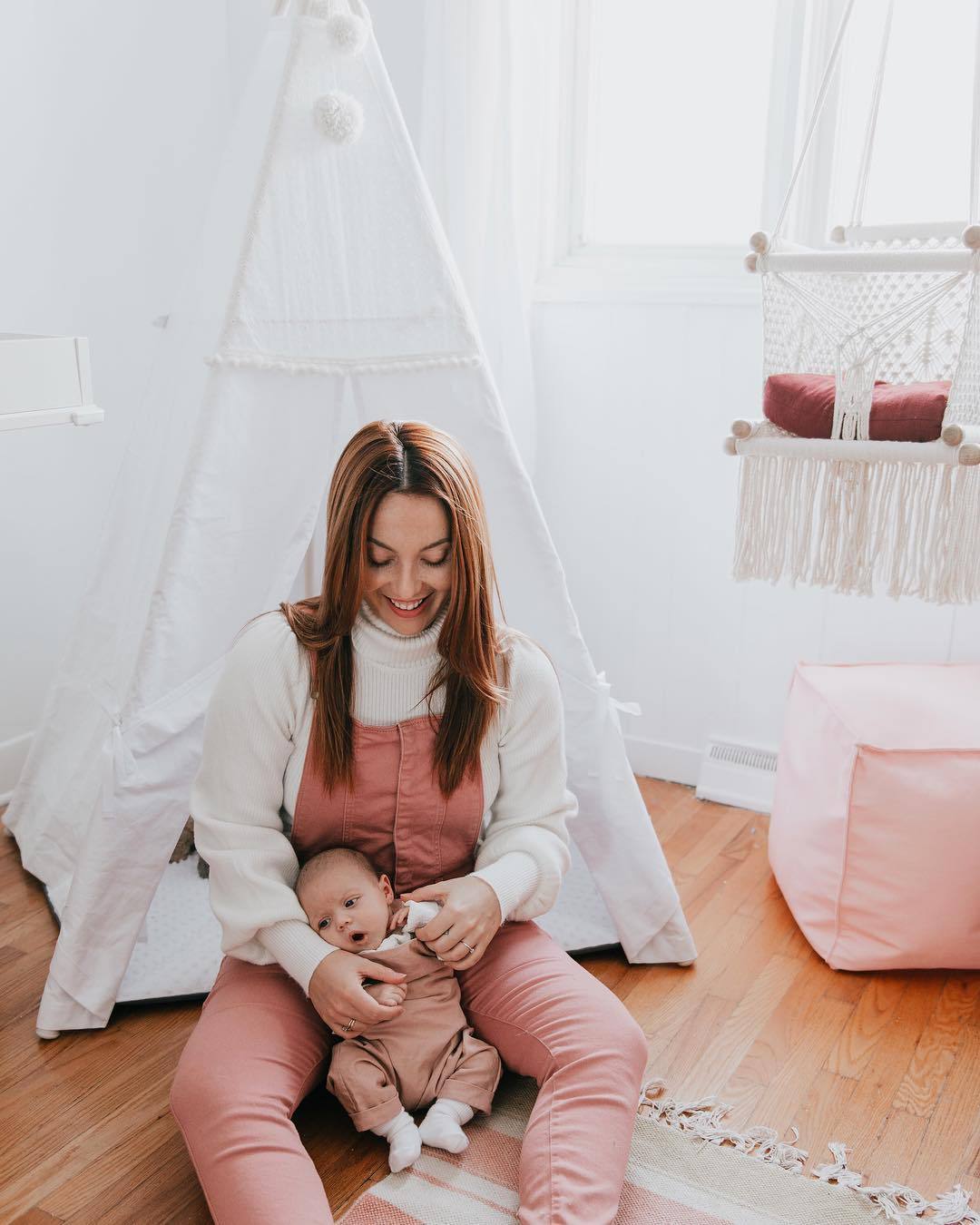 mother play with her son in the nursery room