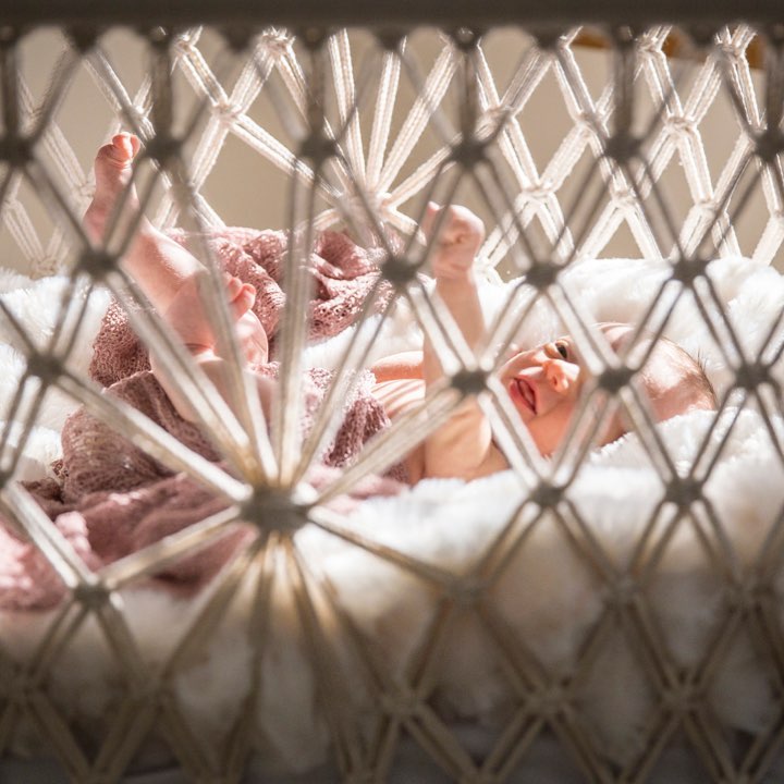 baby moving in a hanging bassinet
