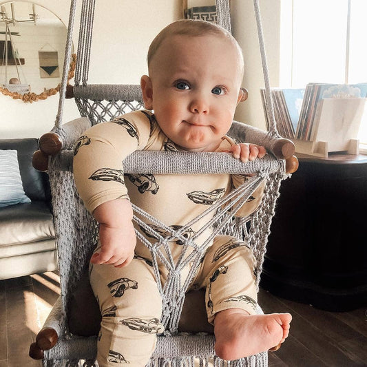 baby on a macrame swing chair
