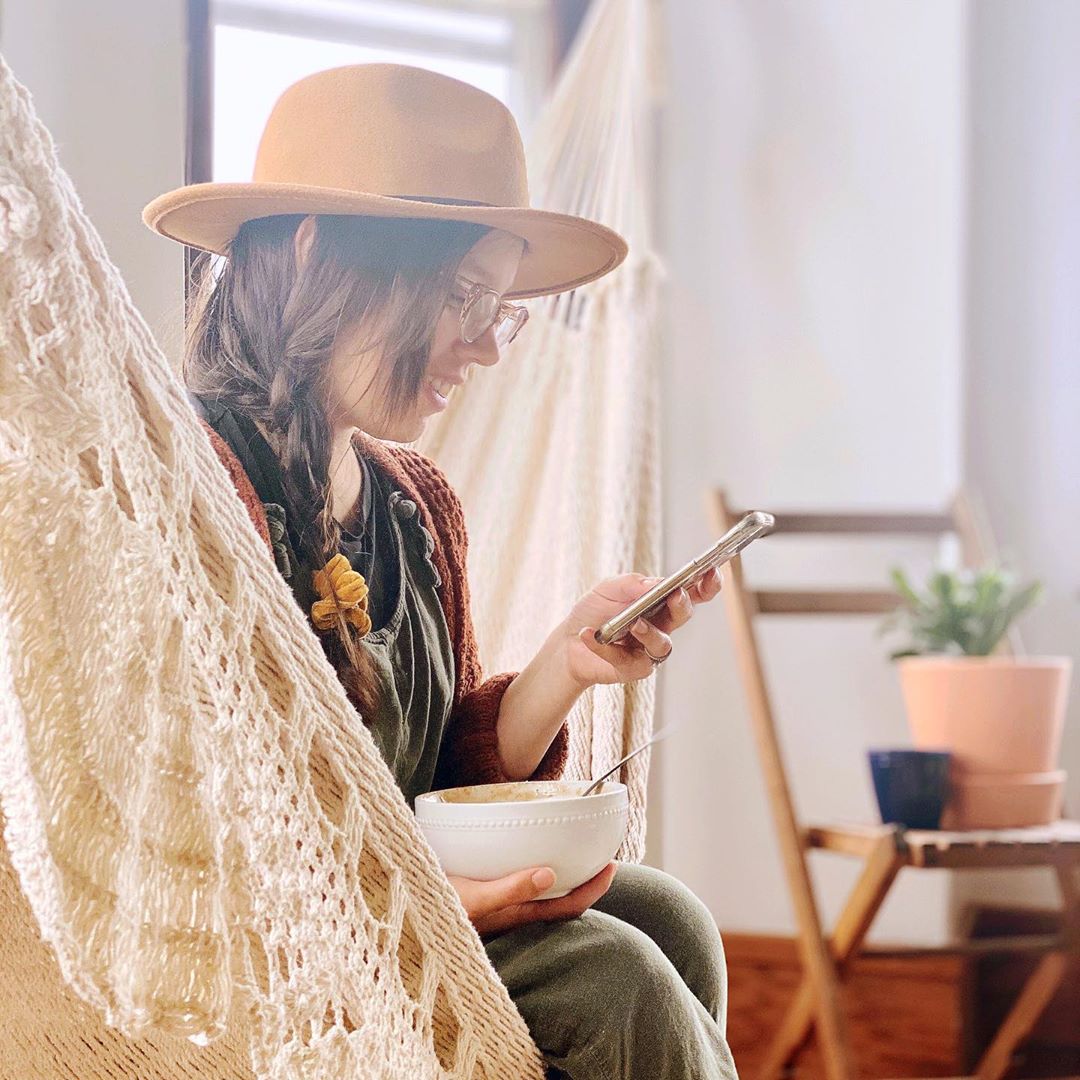 chatting mobile phone on a hammock