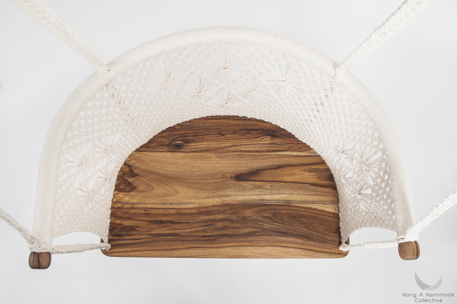 Unique wood grain patterns on handcrafted teak hardwood chair frame