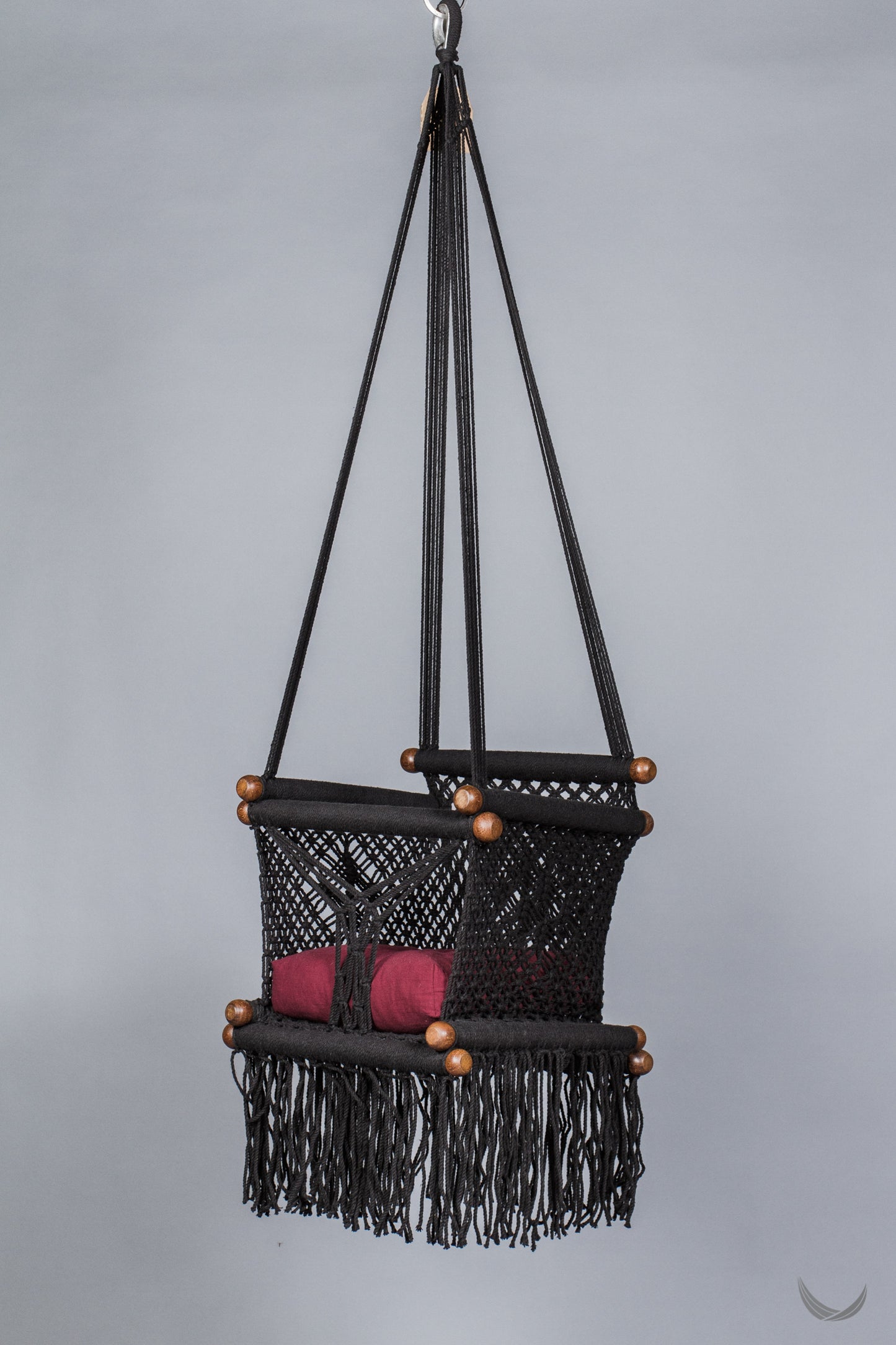 black color baby swing chair with a red color pad