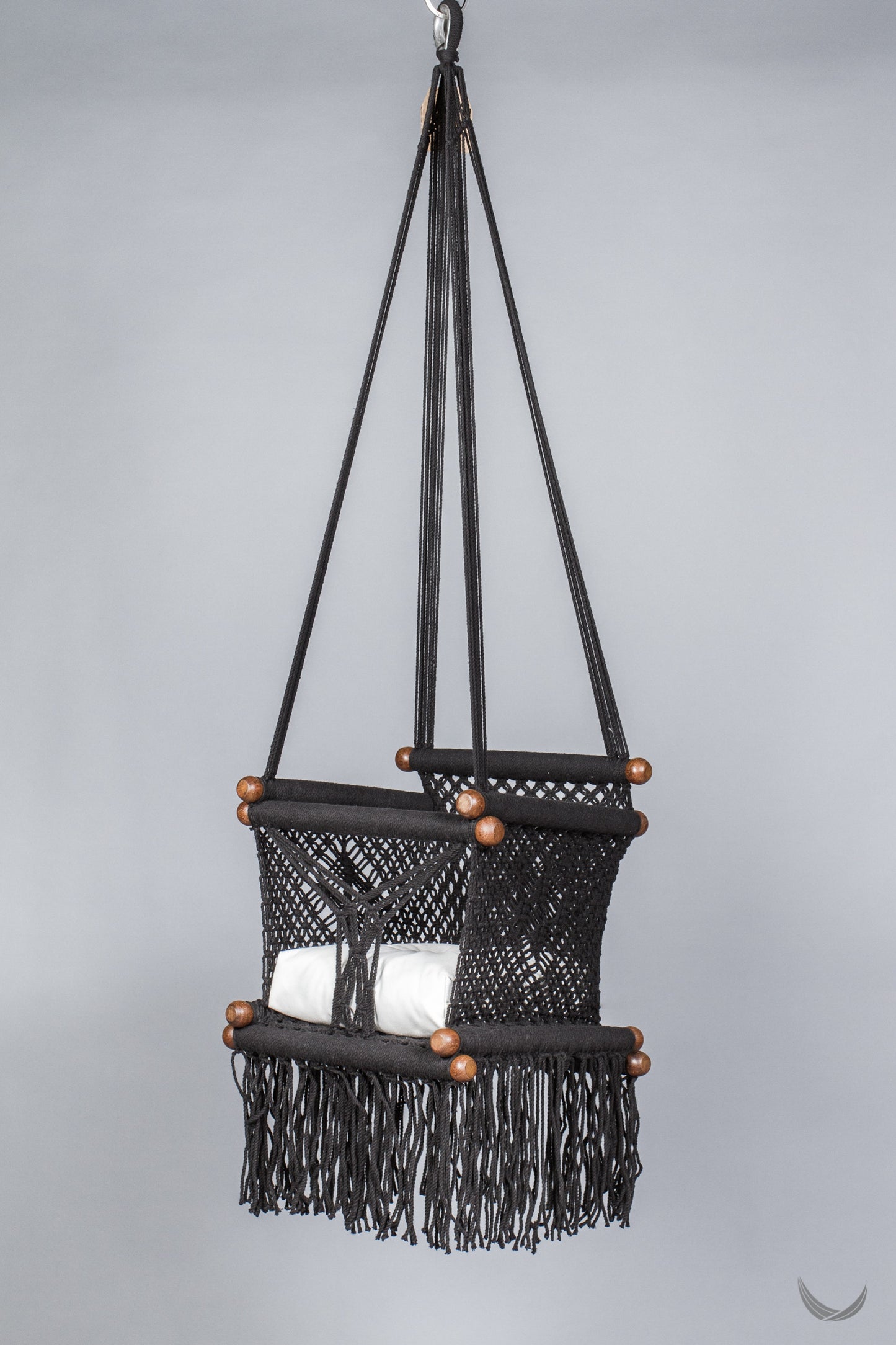 black color baby swing chair with a ivory color pad