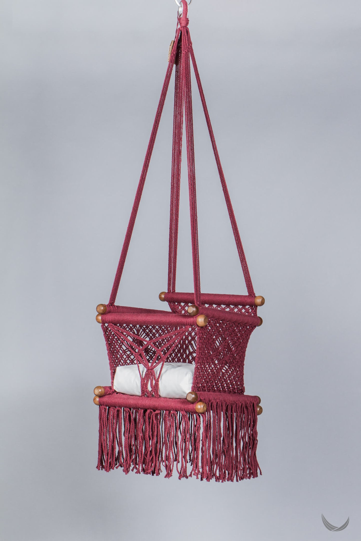 macrame swing in bordeaux with off-white cushion