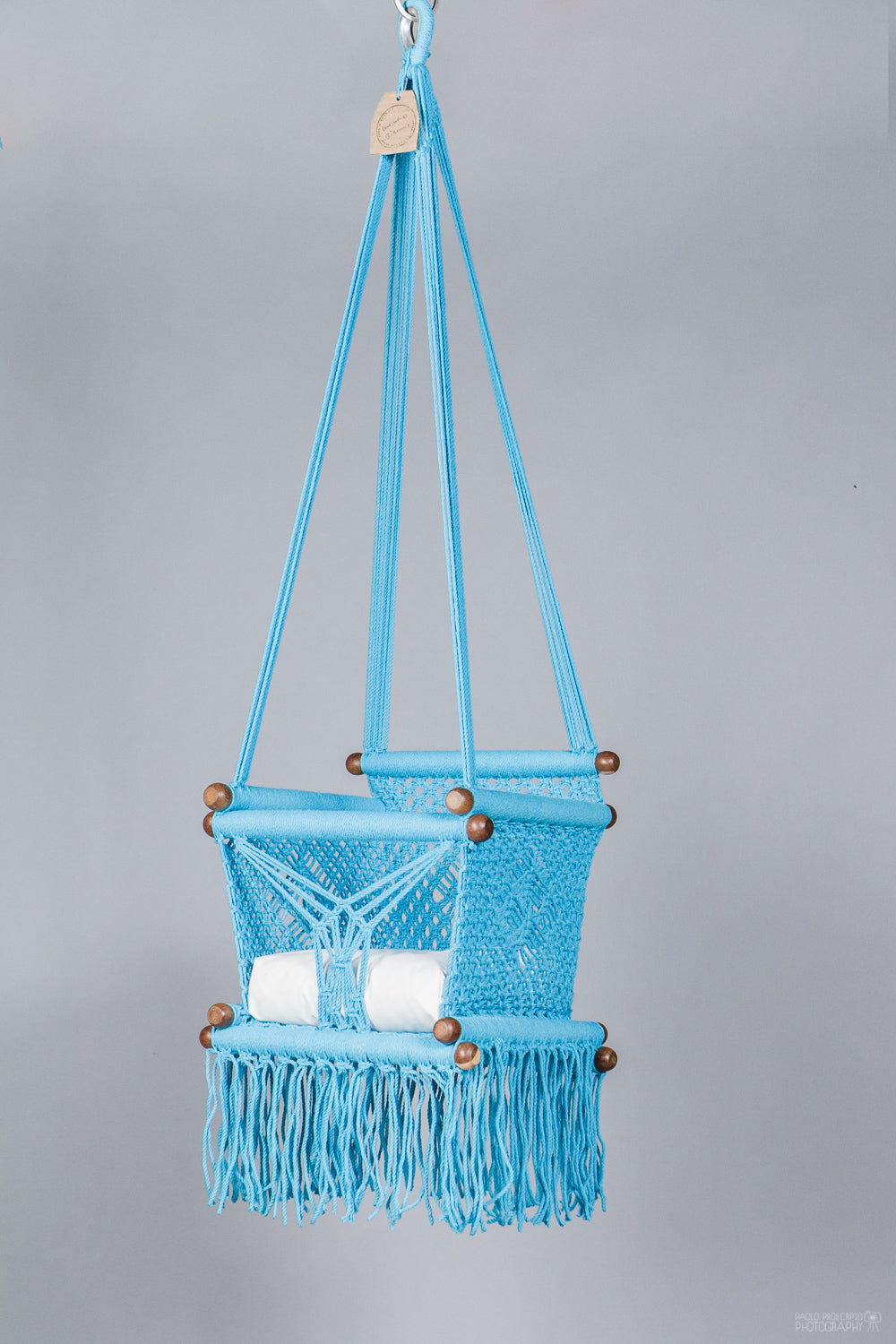 baby swing chair in Turquoise color with white cushion - studio picture