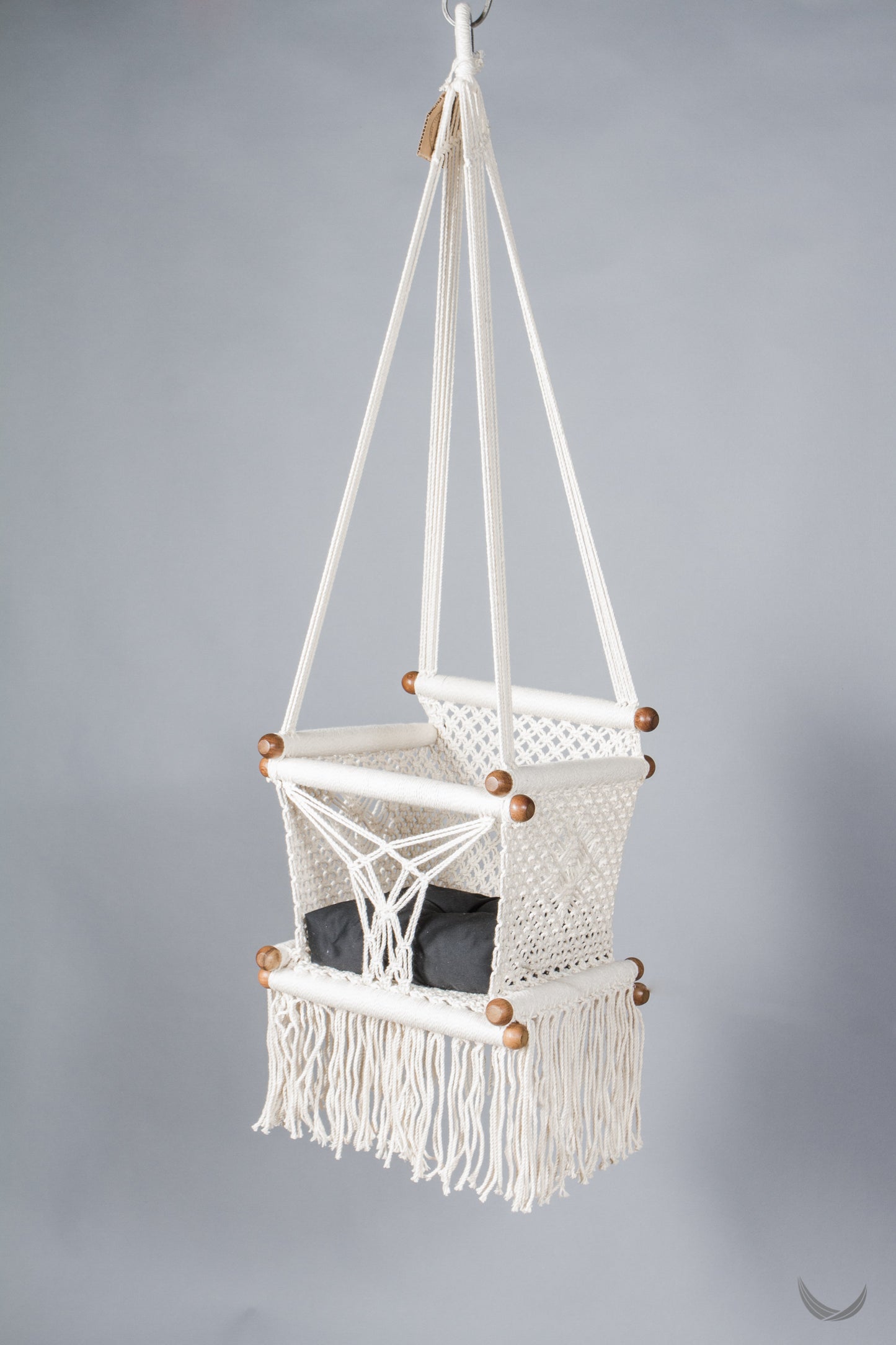 ivory color baby swing chair with a black color pad