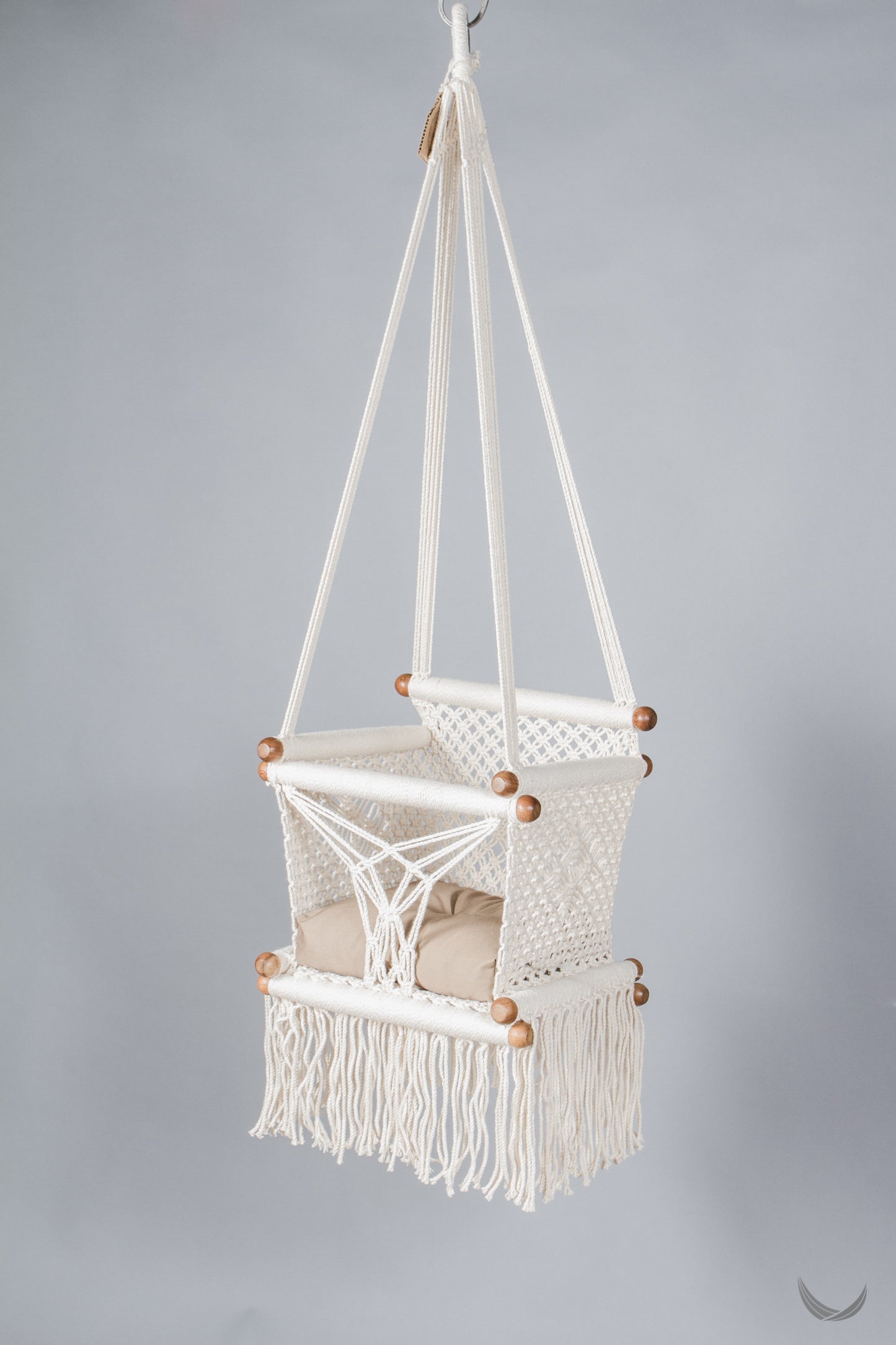 ivory color baby swing chair with a khaki color pad