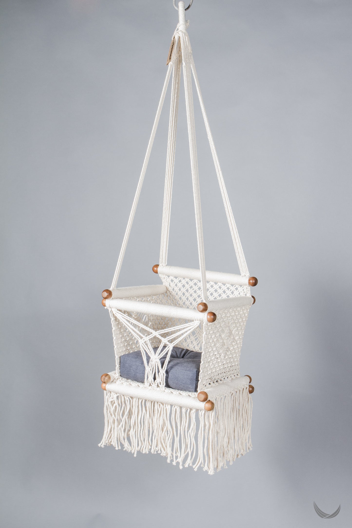 ivory color baby swing chair with a blue color pad