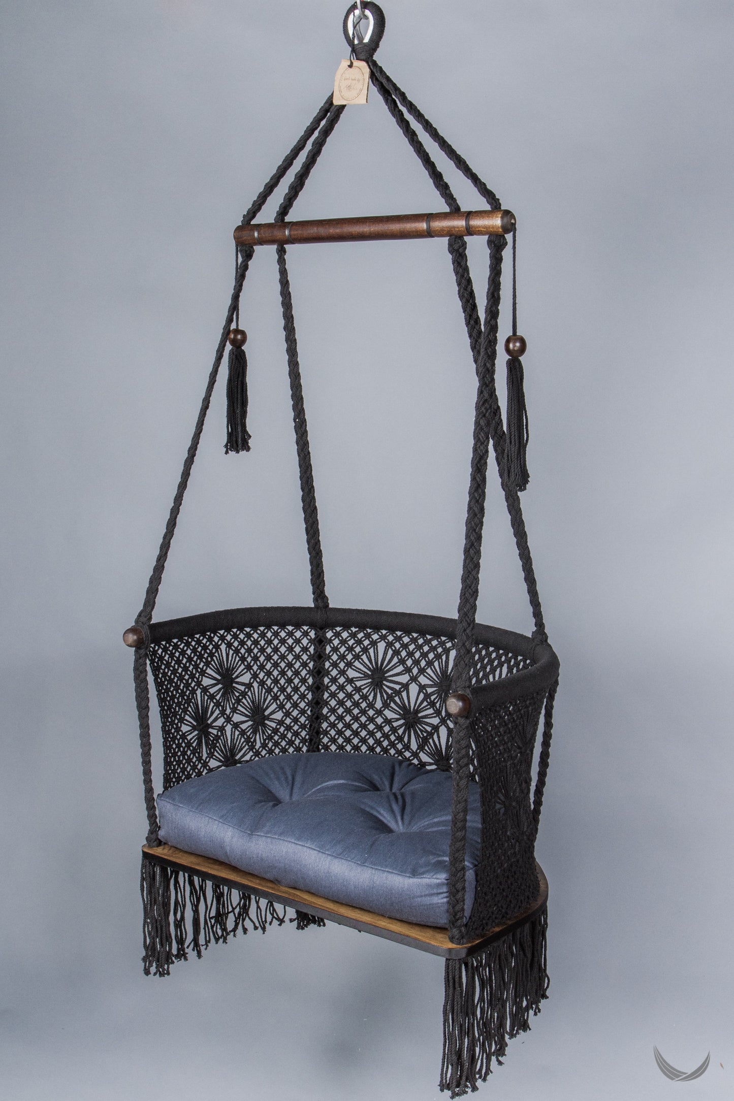 black color hanging chair with a blue color cushion
