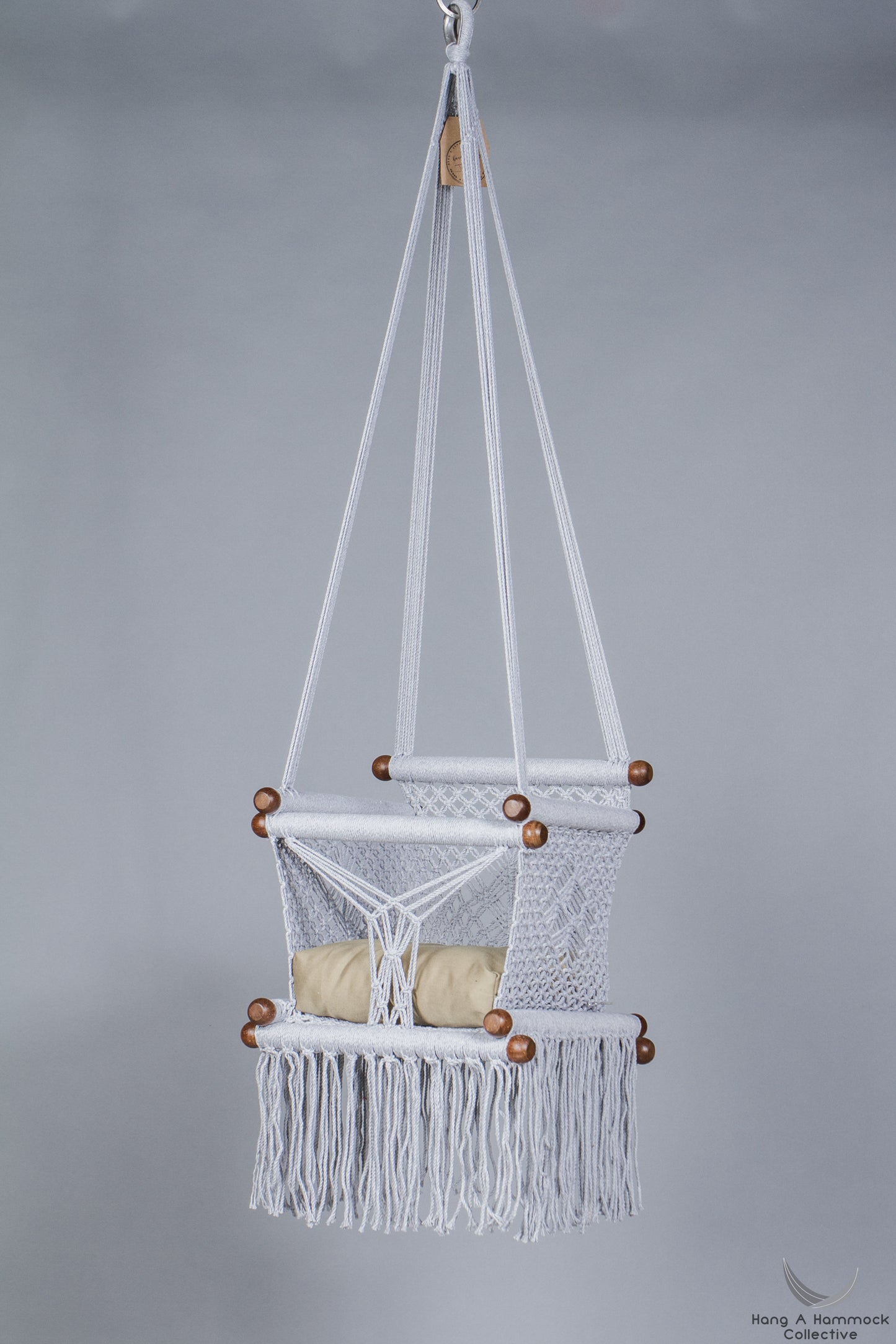 baby swing chair in grey - khaki cushion - studio picture