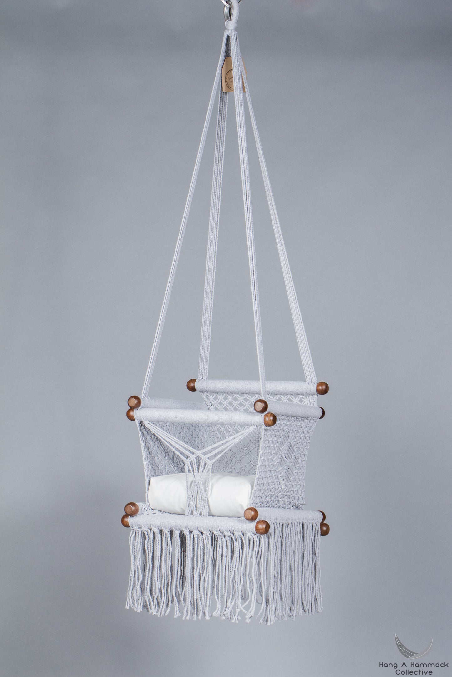 baby swing chair in grey - ivory cushion - studio picture