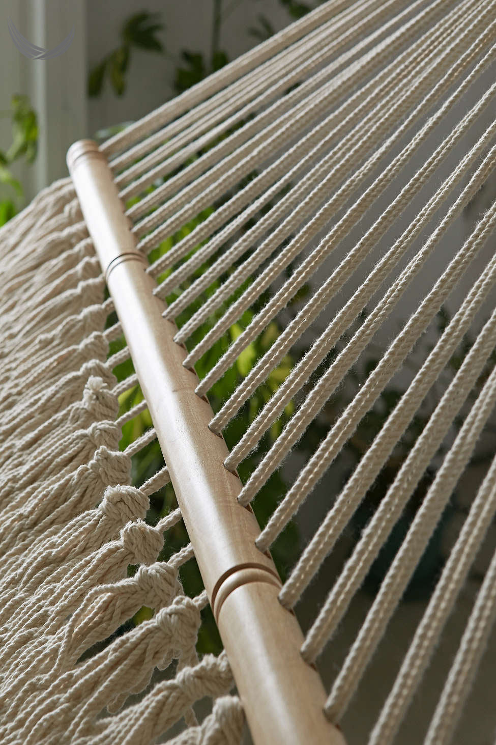 Sustainably sourced wooden spreader bars on artisan handwoven hammock