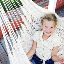 kid on hammock chair