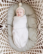 baby in a bassinet - top view