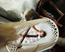 baby sleeping in a hanging cradle - picture from the top