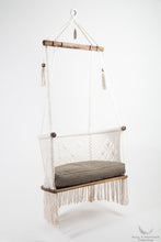 teak wood hanging chair with chair pad, side view