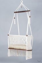 ivory color hanging chair with a khaki color cushion