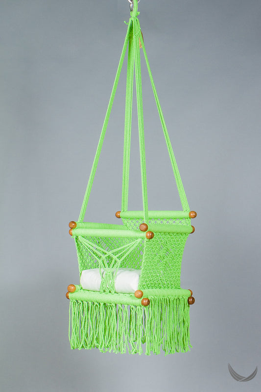 swing chair in macrame - pistachio color - with cream cushion - studio photo