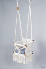 ivory color baby swing chair with a blue color pad