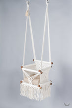 ivory color baby swing chair with a khaki color pad
