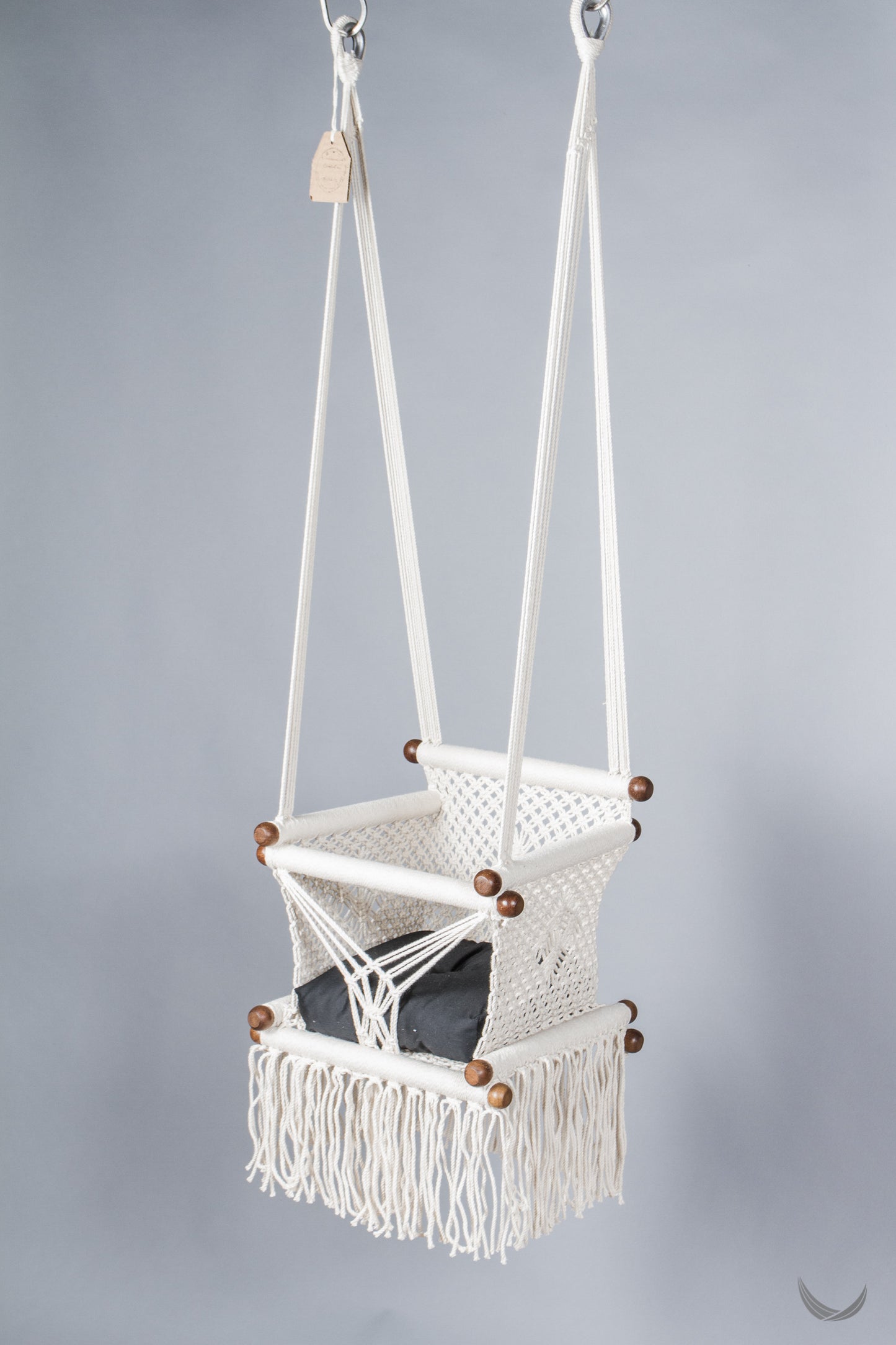 ivory color baby swing chair with a black color pad