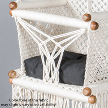 detail of a black cushion on a baby swing chair
