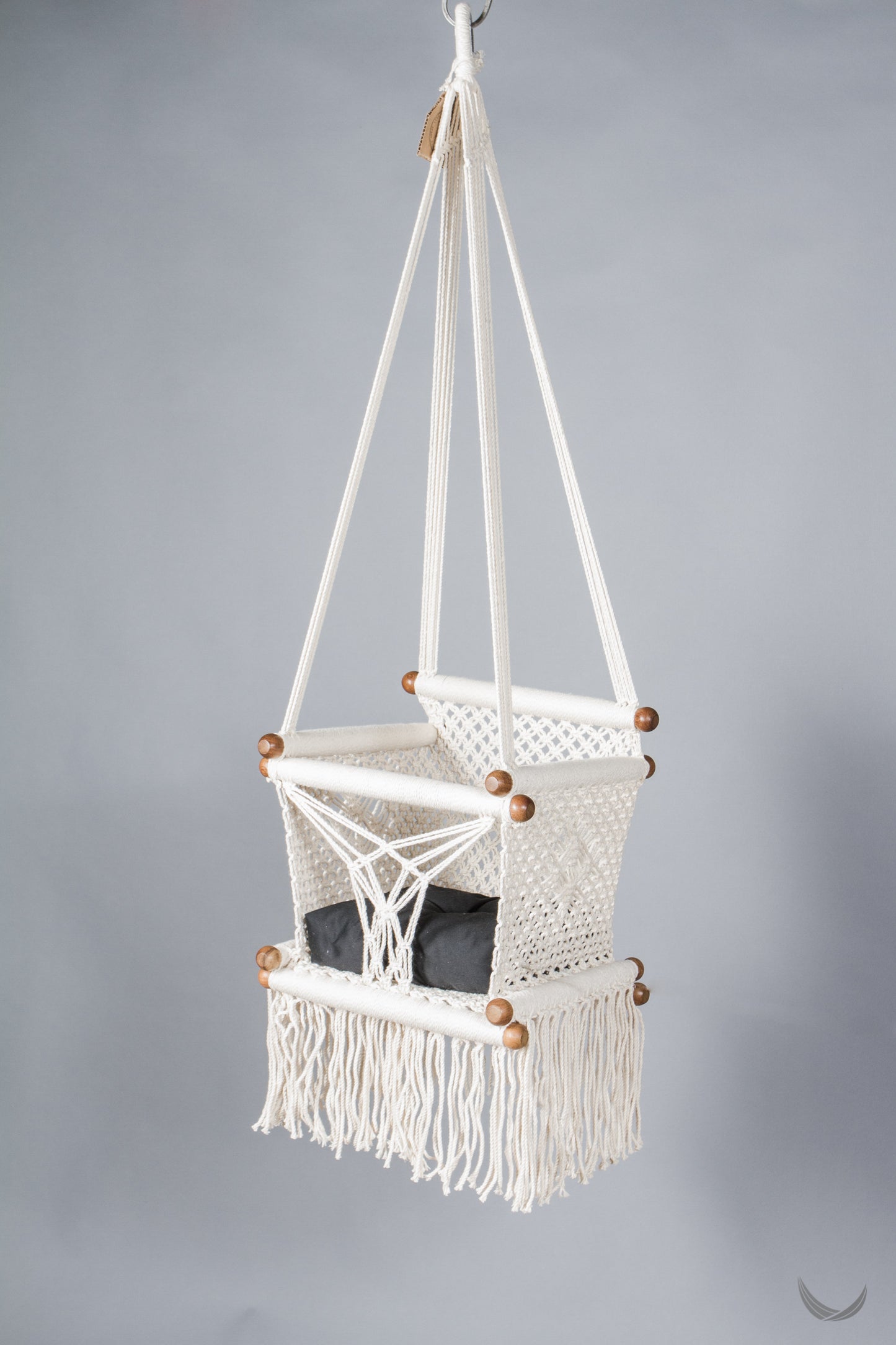 ivory color baby swing chair  with a black color pad