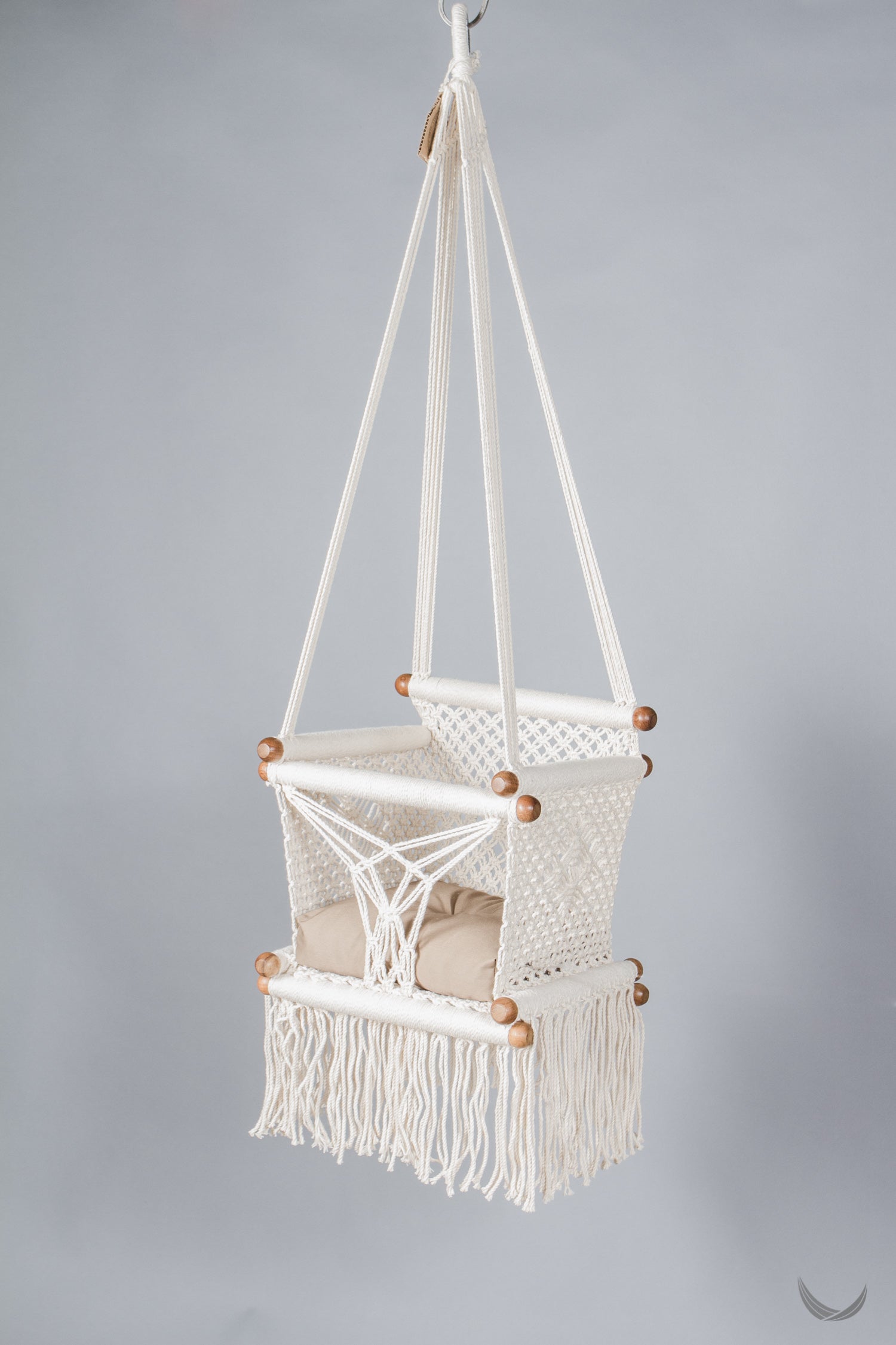 ivory color baby swing chair  with a khaki color pad