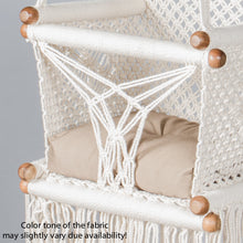 detail of a beige cushion on a baby swing chair