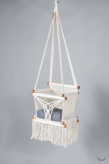 ivory color baby swing chair  with a blue color pad