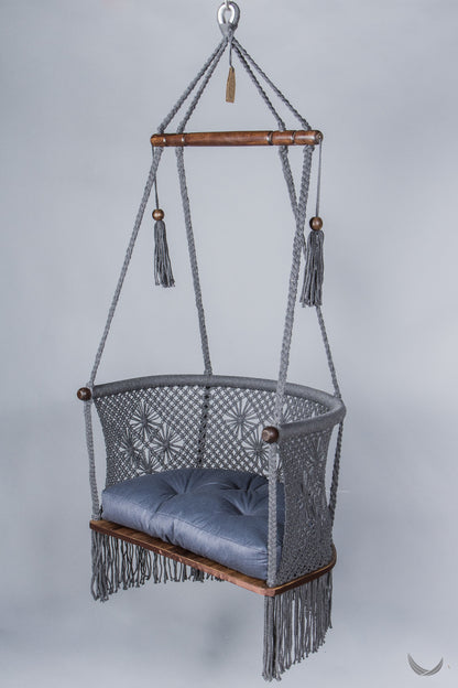 gray color hanging chair with a blue color cushion