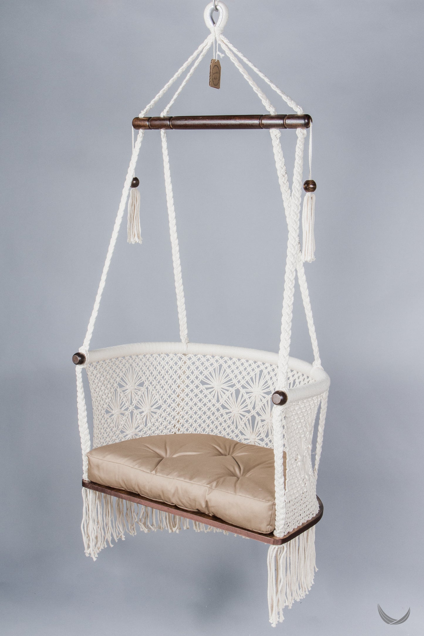 ivory color hanging chair with a khaki color cushion