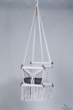 baby swing chair in grey - black cushion - studio picture