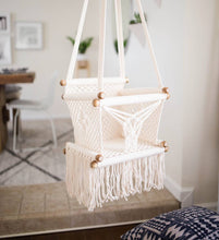 baby swing chair in macrame - styled photo kids room angle view