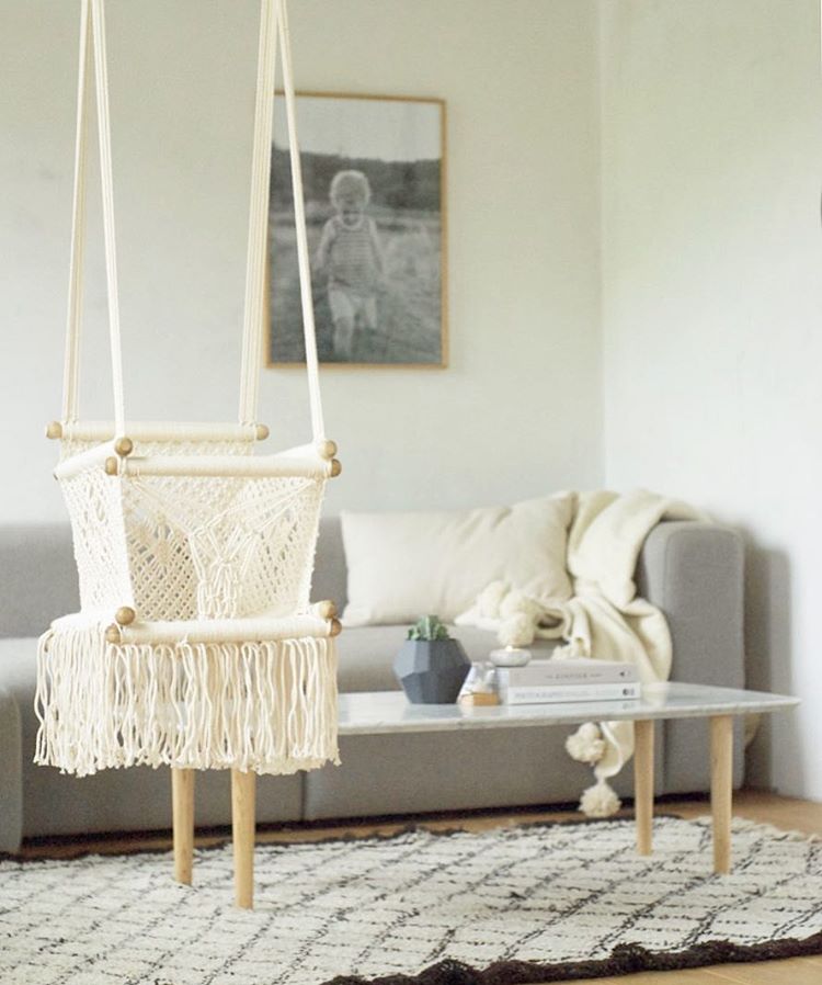 ivory color baby swing chair in the louge room