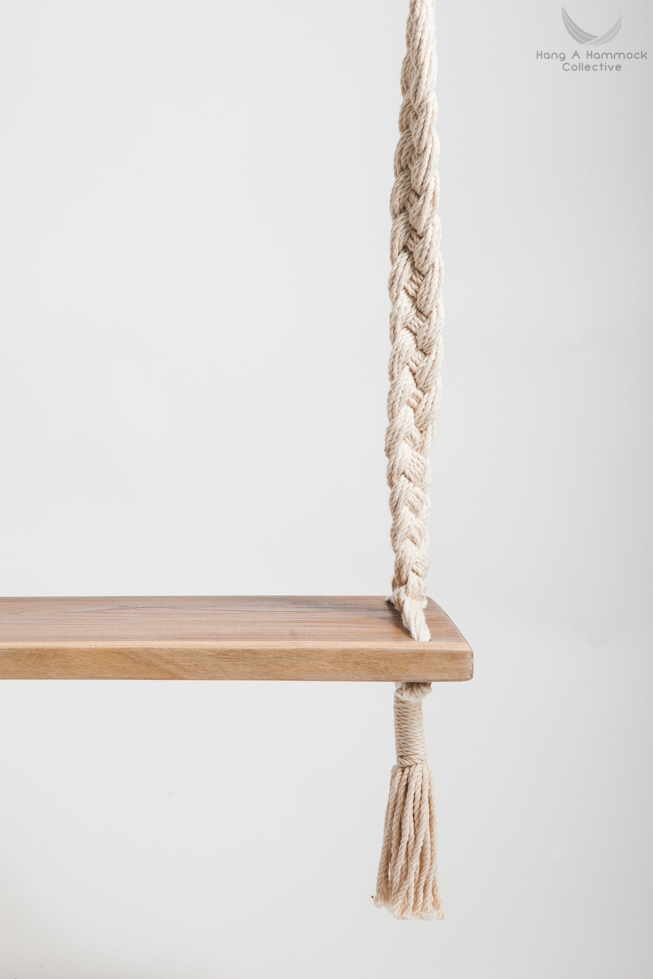Braided Rope Swing - detail of the timber seat - white backgorund