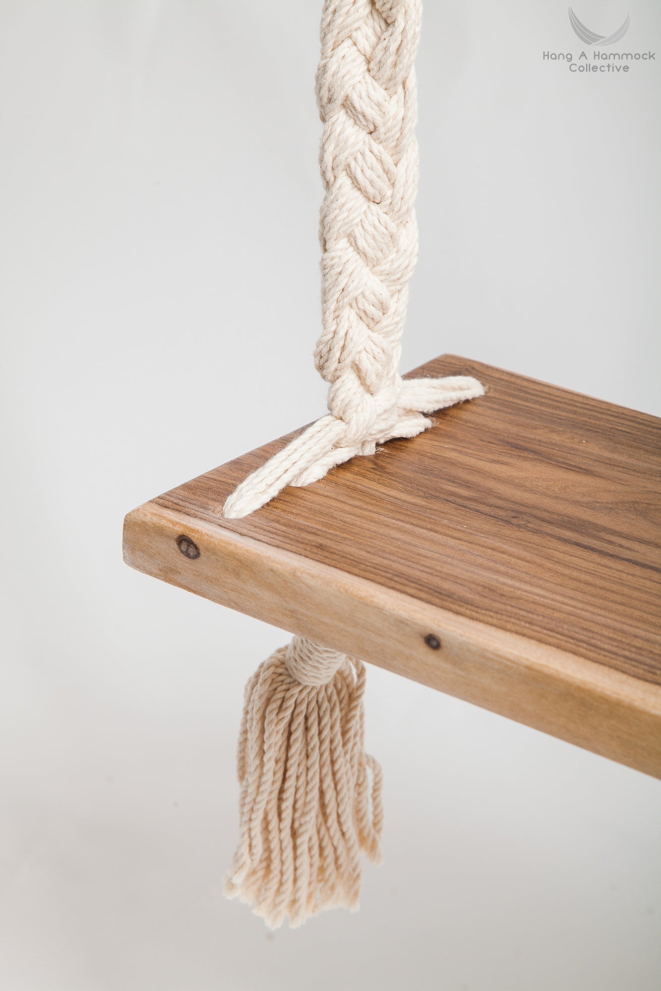 Braided Rope Swing - detail of the timber seat - white background