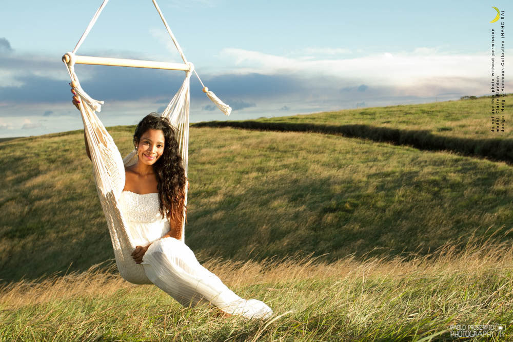 sitting on a hammock chair and landscape on background