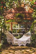 Yucatan hammock in a green house - vertical picture