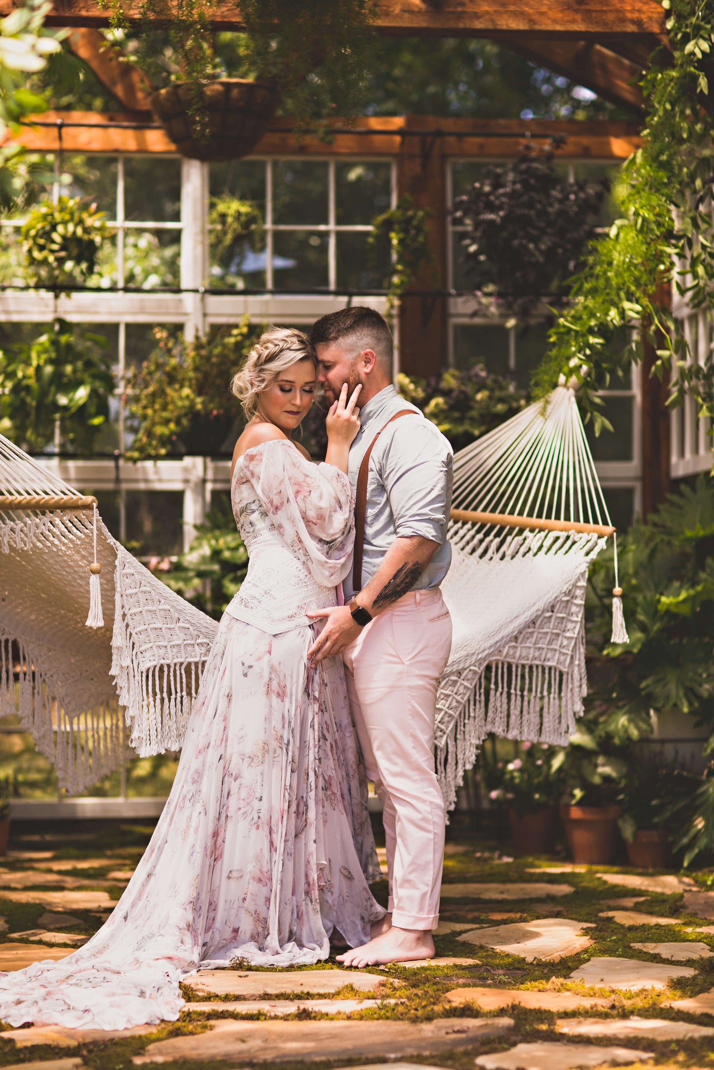 bride and groom next to a hammock
